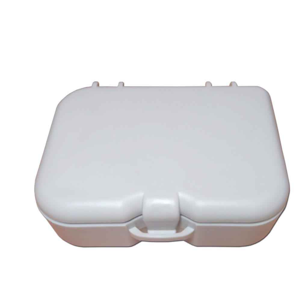 denture case travel kit with a mirror brush closed