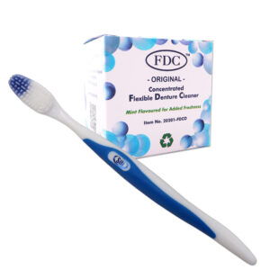 Flexible denture cleaner powder and silicone bristled toothbrush