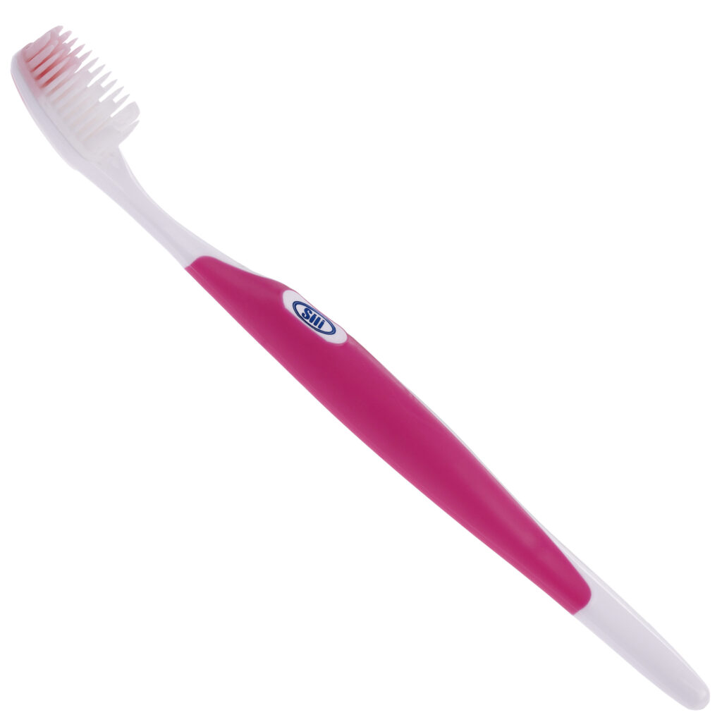 Silicone bristled toothbrush. Pink handle.