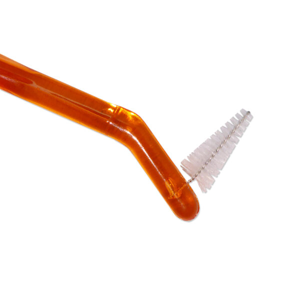 Orthodontic toothbrush interdental end.