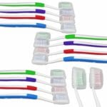 Adult manual toothbrushes with clip on travel covers for brush heads. Available with four different colour grips-Red, Blue, Green and Purple.