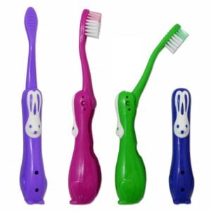 Set of four brightly coloured children’s foldable rabbit toothbrushes for travel