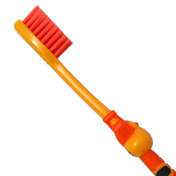Children's manual toothbrush. Close up of bristles, orange and yellow giraffe design.
