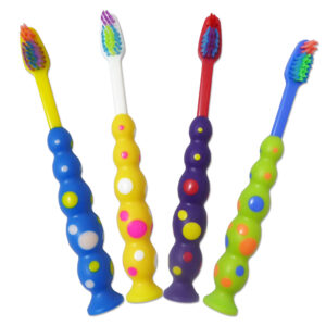 Children's Toothbrushes. Suction base with dotty colourful handles.